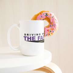 Driving_Home_the_Faith_15oz_Mug_15ozWhiteMugLifetsyleDonutLH_Mockup.png_15747990